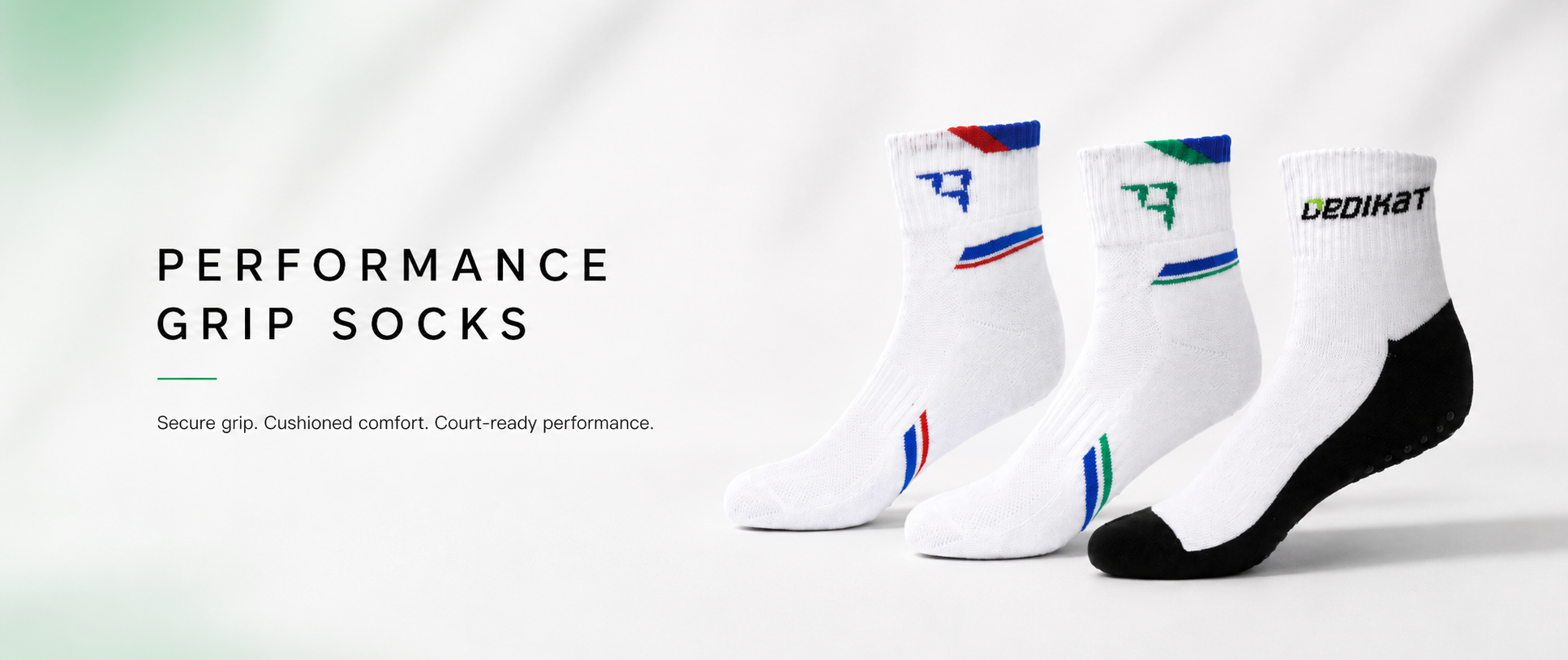 Performance grip socks with branding on a light gray background